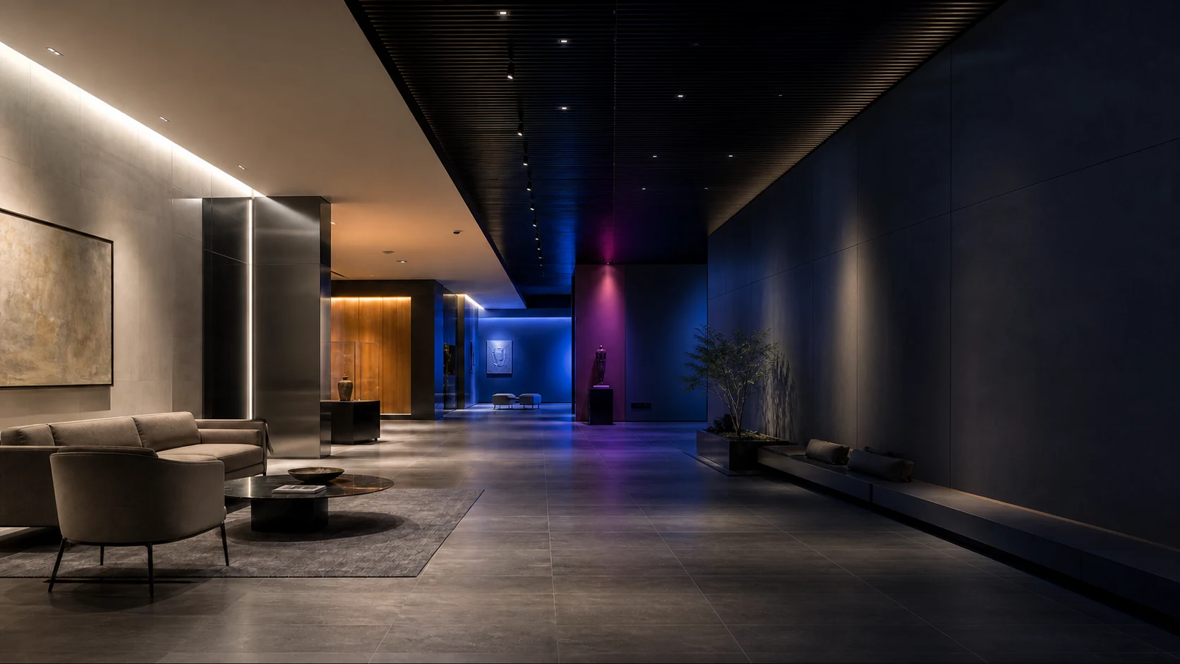 Architectural lounge showing controlled neutral white, amber, blue and magenta lighting across one continuous space
